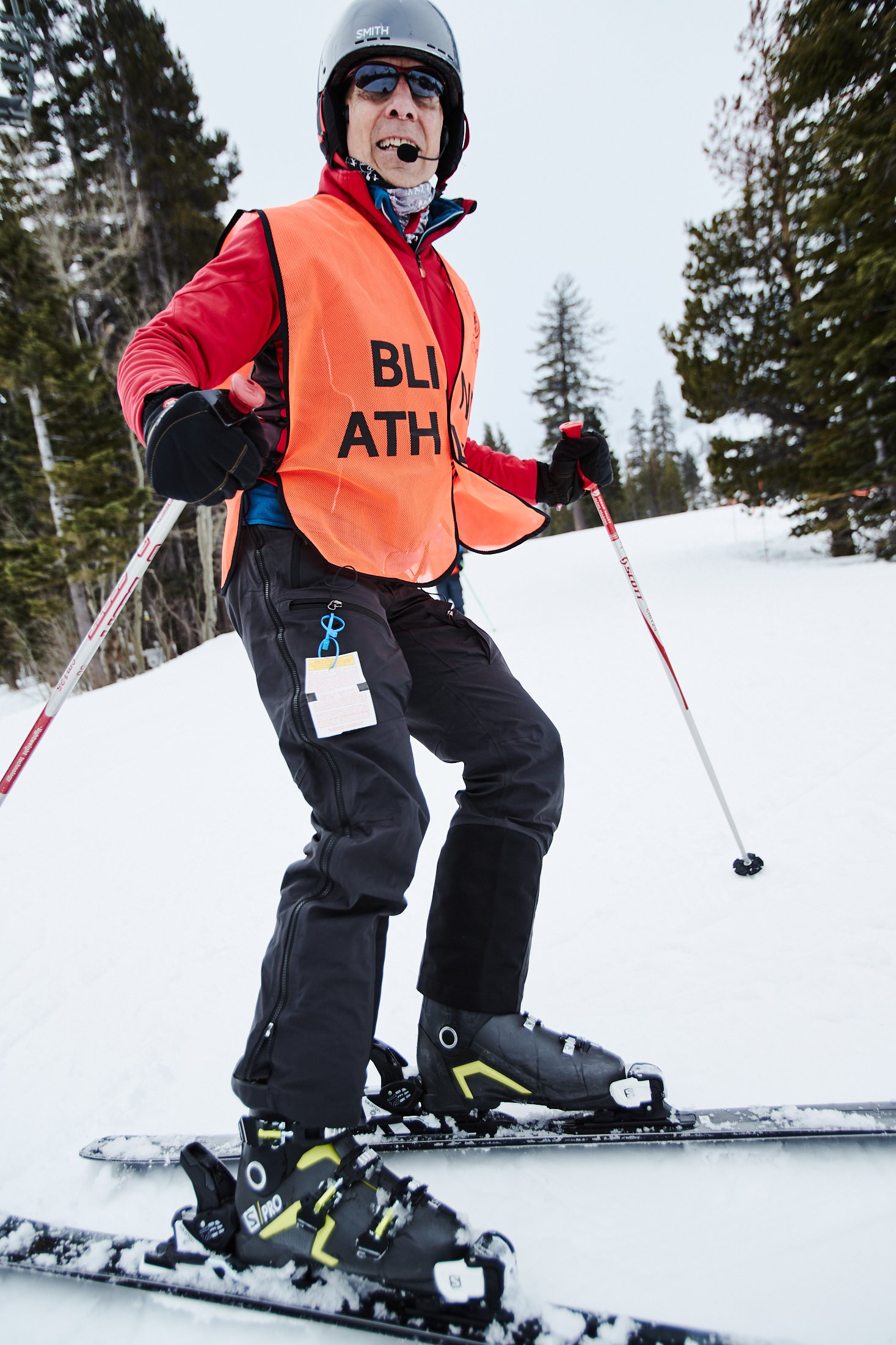 Walt Raineri, wearing a blind athlete vest, skis in Like Tahoe